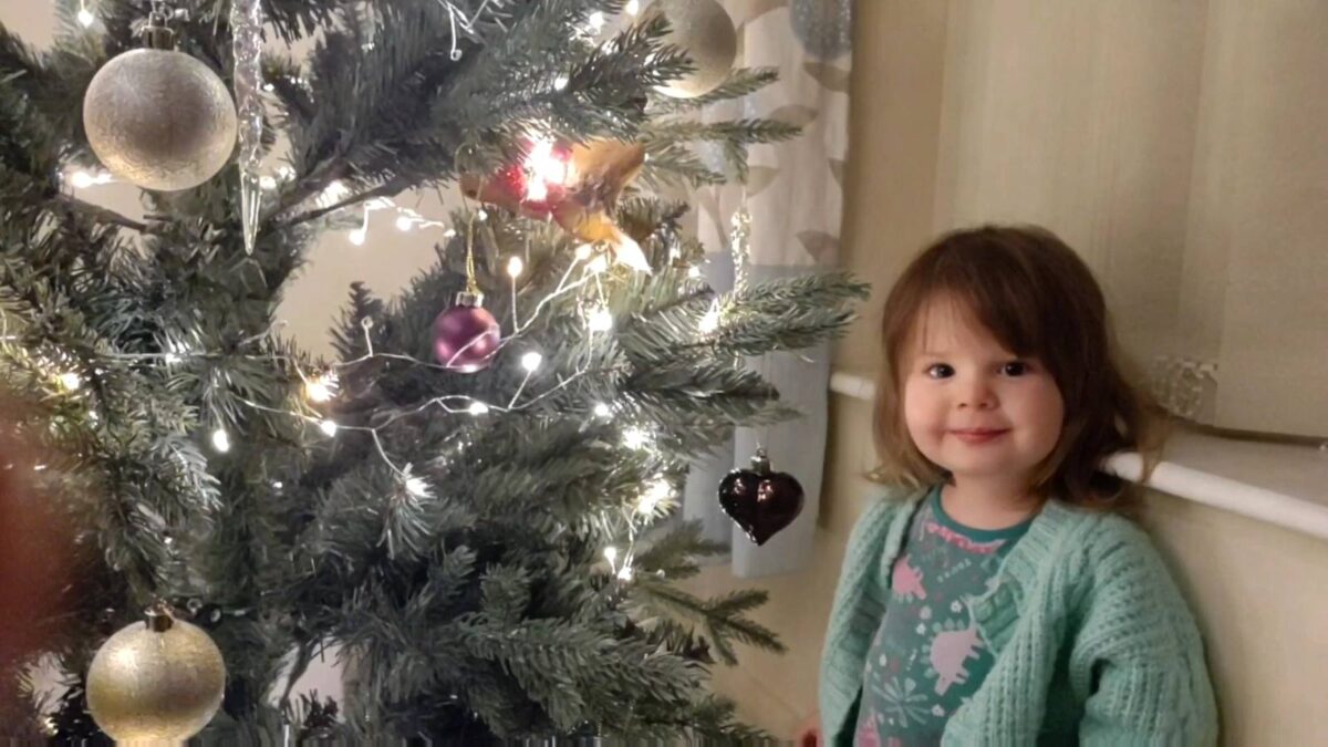 Our daughter and Christmas tree photo